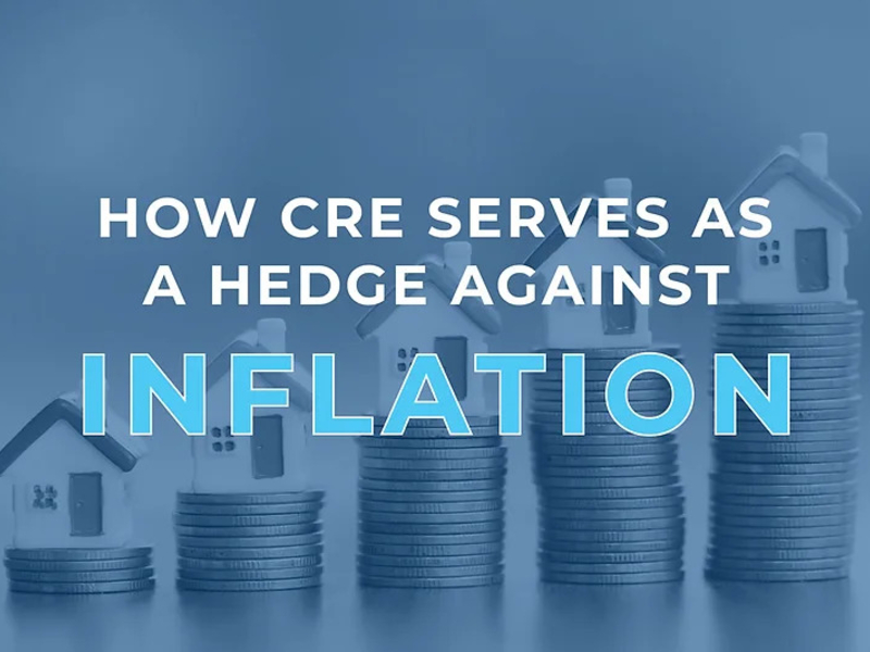 CRE as inflation hedge: houses on coin stacks illustrating commercial real estate benefits during inflation.