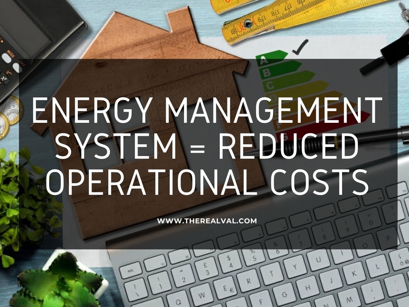 Energy management system concept with house cutout, keyboard, and efficiency chart for cost reduction.