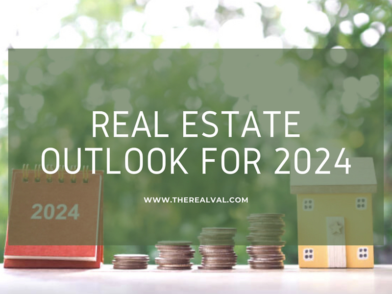 Real estate outlook for 2024 with coins, calendar, and house model. www.therealval.com